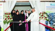  HMC officials cutting the ribbon to open the exhibition.