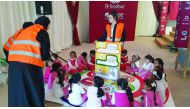 Children taking part in the 33rd GCC Traffic Week at Darb El Saai.