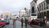 Syrian security forces cordon off the area following a reported suicide bombing at the old palace of justice building in Damascus on March 15, 2017.   AFP / STRINGER

