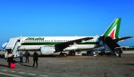 An Alitalia plane on the runway at the airport of Brindisi.  