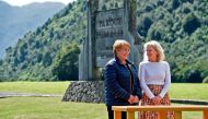This handout photo released by the Chilean presidency shows President Michelle Bachelet (L) before signing a document to receive donation of 407,000 hectares of land from Kristine McDivitt (R) - the widow of U.S. conservationist and philanthropist Douglas