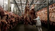 This image of a worker arranging slaughtered cattle in the freezing room, in the Marfrig Group slaughter house in Promissao, 500 km northwest of Sao Paulo, taken on October 7, 2011, is used for graphical purpose only. (REUTERS/Paulo Whitaker) 