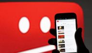 A picture illustration shows YouTube on a cell phone, in front of a YouTube copyright message regarding a video on an LCD screen, in central Bosnian town of Zenica, early June 18, 2014. REUTERS/Dado Ruvic