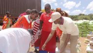 People getting aid from the Qatar Charity's relief campaign.