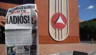 A man shows a copy of the North newspaper which announces the closing of its printed edition in Ciudad Juarez, Chihuahua, Mexico on April 2, 2017. AFP / STR