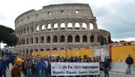 Taxi drivers protest in Rome in response to an amendment that drivers say will favor smartphone app-based car transport company Uber and unfair competition from unauthorized operators, in Rome, Italy on March 23, 2017. ( Alvaro Padilla - Anadolu Agency )