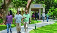 Employees of Infosys Technologies Limited walk in the campus of the company's headquarters in Bangalore on April 13, 2017. Indian software giant Infosys has pledged to return USD2 billion to shareholders this year as it reported subdued growth in profits 