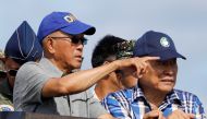 Filipinos living in Philippine occupied (Pagasa) Thitu island, in disputed South China Sea, sing the country's national anthem April 21, 2017. REUTERS/Erik De Castro