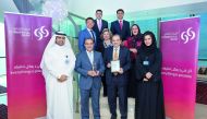 Commercial Bank CEO Joseph Abraham (second left) and other officials with the two awards.