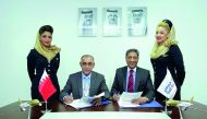 Ahmed Janahi (second left), Gulf Air Chief Commercial Officer and Vinay Malhotra (second right), Chief Operating Officer - Middle East and South Asia, VFS Global, at the signing ceremony in Dubai.