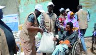 A man receiving food basket at a distribution centre set up by RAF in Ethiopia.