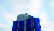EU flags fly in front of European Central Bank headquarters in Frankfurt.

