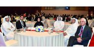 Officials, QU faculty and school teachers at the Forum.