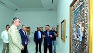 Mehmet Cebi, with other officials at the exhibition of his Contemporary Calligraphy collections at the MIA Al Riwaq in Doha, yesterday. Pic: Salim Matramkot/The Peninsula