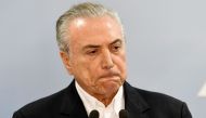 Brazilian President Michel Temer makes a statement at Planalto Palace in Brasilia, Brazil, on May 20, 2017 (AFP Photo/EVARISTO SA).