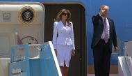 US President Donald Trump and First Lady Melania Trump wave as they disembark Air Force One upon their arrival at Ben Gurion International Airport in Tel Aviv on May 22, 2017, as part of his first trip overseas. / AFP / MANDEL NGAN.