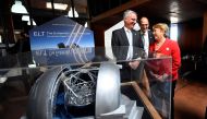 Chile's President Michelle Bachelet and Director General of the European Southern Observatory (ESO) Tim de Zeeuw (L) are seen next to a scale model of the world's largest telescope during a ceremony to inaugurate its construction in the desert of Atacama,