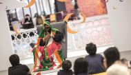 Children enjoying the traditional story-telling by Um Khalaf at Doha Festival City.