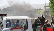 NATO security officials inspect the site of a powerful suicide attack in Kabul, Afghanistan on May 31, 2017. Haroon Sabawoon - AA
