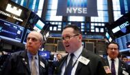Traders work on the floor of the New York Stock Exchange (NYSE) shortly after the opening bell in New York, U.S., March 20, 2017. REUTERS/Lucas Jackson.