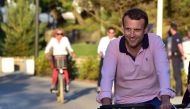 The euro edged up after President Emmanuel Macron's party won a healthy majority in weekend elections, giving him a mandate to enact business-friendly reforms (AFP Photo/CHRISTOPHE ARCHAMBAULT).