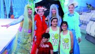 Children with cartoon characters during the Eid celebration at Souq Waqif Al Wakrah. Pic: Abdul Basit / The Peninsula 