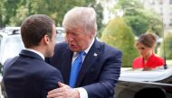French President Emmanuel Macron (L) greets U.S. President Donald Trump at Les Invalides museum in Paris, France, July 13, 2017. (REUTERS/Michel Euler/Pool)