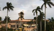 This file photo taken on December 30, 2016 shows workers as they lay out the red carpet at Mar-a-Lago Club in Palm Beach, Florida. AFP / Don Emmert