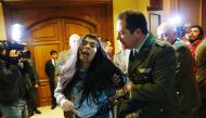 A demonstrator is detained by police officers after shouting slogans against abortion inside the Chilean congress during a session legislating a draft law which seeks to ease the country's strict abortion ban, in Valparaiso, Chile July 18, 2017. Reuters/R