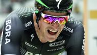 Poland’s Maciej Bodnar crosses the finish line to win  the 20th stage of the Tour de France cycling race.