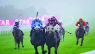 Tayf, owned by Sheikh Abdullah bin Khalifa Al Thani, centre, on its way to win the Qatar International Stakes (Gr1PA) on the second day of the Qatar Goodwood Festival in West Sussex, England yesterday.