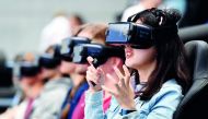 Visitors try out VR glasses at the booth of Samsung at the IFA Consumer Electronics Fair in Berlin on September 2, 2017. The fair is open for the public from September 1 to 6, 2017. AFP / dpa / Maurizio Gambarini