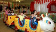Children enjoying a ride. Pic: Qassim Rahmatullah © The Peninsula