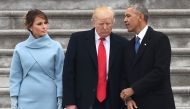 FILE PHOTO: US President Donald Trump speaks to former President Barack Obama as First Lady Melania Trump looks on after inauguration ceremonies at the US Capitol on January 20, 2017 in Washington (AFP / Robyn BECK) 