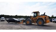 A forklift moves a car damaged by Hurricane Harvey at a local staging area run by Insurance Auto Auctions Inc, which has launched a major operation to process damaged cars for its insurance company customer base in Houston, Texas, U.S. on September 5, 201