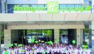 Employees at the opening of the Holiday Inn Doha — The Business Park.
