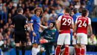 Chelsea's David Luiz is shown a yellow card by referee Michael Oliver. Reuters/John Sibley 