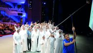 Graduates of Sky Climbers second batch setting a Guinness World record by taking a selfie with the world’s longest Selfie stick at QNCC. Pic Abdul Basit / The Peninsula.