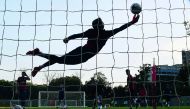 A goalkeeper with the U-17 English football team practises at the Sports Authority of India (SAI) Complex ahead of the forthcoming FIFA U-17 World Cup, in Kolkata on Wednesday.