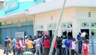 People break into a supermarket during an opposition National Super Alliance (NASA) coalition protest calling for the sacking of election board officials involved in August’s cancelled presidential vote, in Kisumu, Kenya, yesterday. 