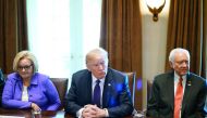 US President Donald Trump (centre), Senator Claire McCaskill (left) & Senate Finance Committee Chairman Orin Hatch take part in a meeting with members of the Senate Finance Committee and his economic team in the Cabinet Room at the White House in Washingt