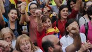 People celebrate after Catalonia's parliament voted to declare independence from Spain on October 27, 2017 in Barcelona.  AFP / PAU BARRENA