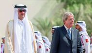 Emir H H Sheikh Tamim bin Hamad Al Thani with the Prime Minister of the Republic of Italy, Paolo Gentiloni, at the Emiri Diwan yesterday.
