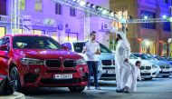 Customers at the weekend extravaganza of Alfardan Automobiles at the used cars showroom in Al Sadd.