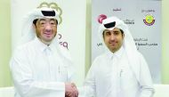 Qatar Chamber Director-General Saleh bin Hamad Al Sharqi and CEO of Manateq, Fahad Rashid Al Kaabi, signing the agreement.