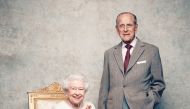 A handout file photo of Britain's Queen Elizabeth and Prince Philip in the White Drawing Room at Windsor Castle in early November, pictured against a platinum-textured backdrop, in celebration of their platinum wedding anniversary on November 20, 2017. Ma
