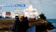 (FILES) This file photo taken on October 30, 2017 shows migrants waiting near the port of Ouistreham, near Caen, northwestern France.  AFP / CHARLY TRIBALLEAU
