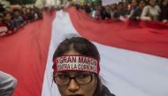 People protest against Fujimorism and corruption in Lima on December 16, 2017, as the presidency of Pedro Pablo Kuczynski hangs in the balance while the opposition, which controls Congress, demands he steps down or face impeachment over graft allegations 