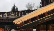An Amtrak passenger train derailment over interstate highway (I-5) is seen in this Washington State Patrol image moved on social media in DuPont, Washington, U.S., December 18, 2017. Courtesy Brooke Bova/Washington State Patrol