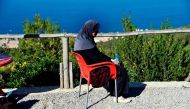Linda, an Algerian mother-of-three who was abandoned by her husband after being dagnosed with breast cancer, sits in Algiers on November 15, 2017. AFP / RYAD KRAMDI
